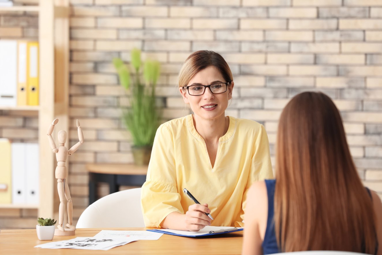 Female Psychologist Working with Patient in Office